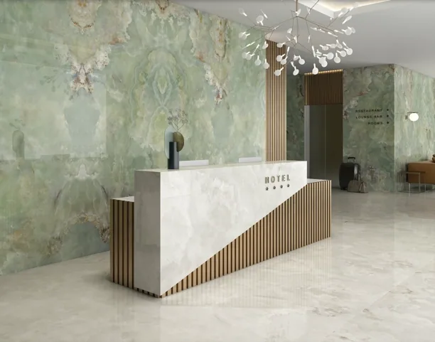 Green onyx hotel reception desk and backlit feature wall